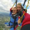 anxious skydiver having eyes covered by skydiving instructor
