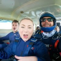 anxious skydivers in plane