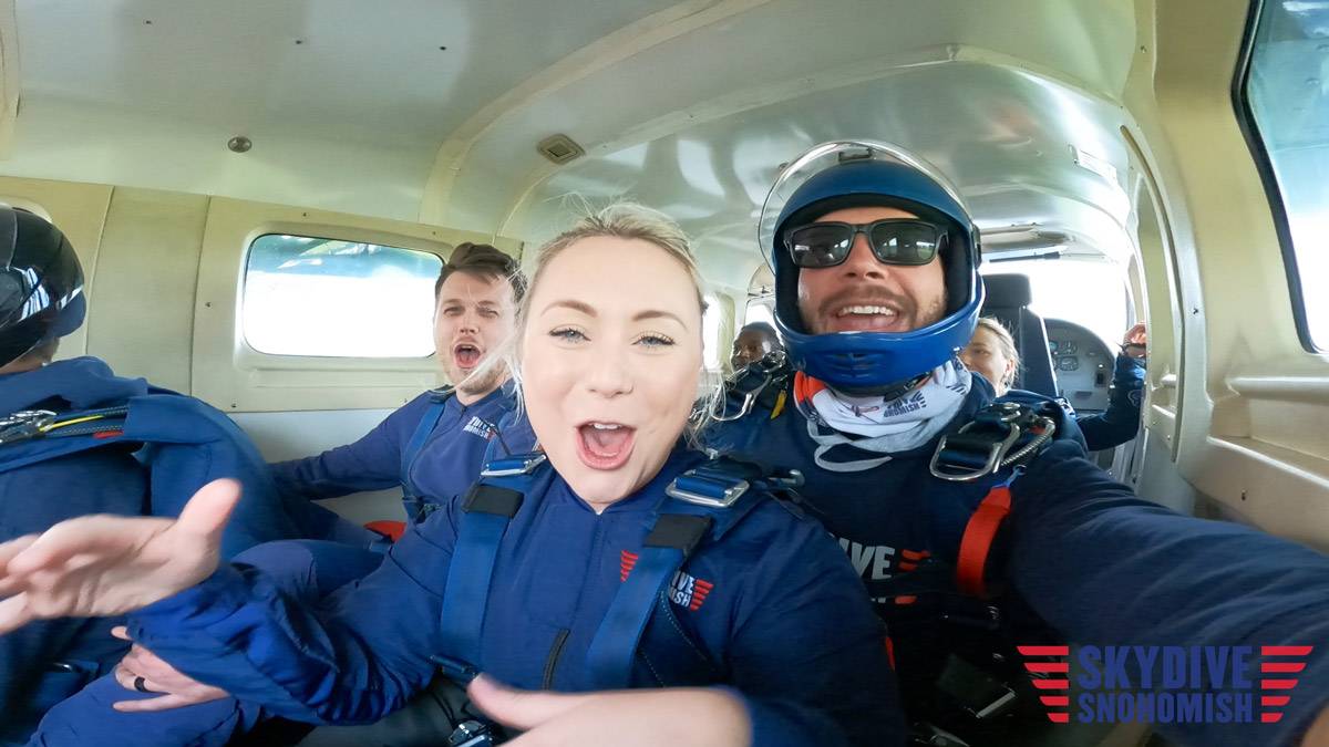 anxious skydivers in plane