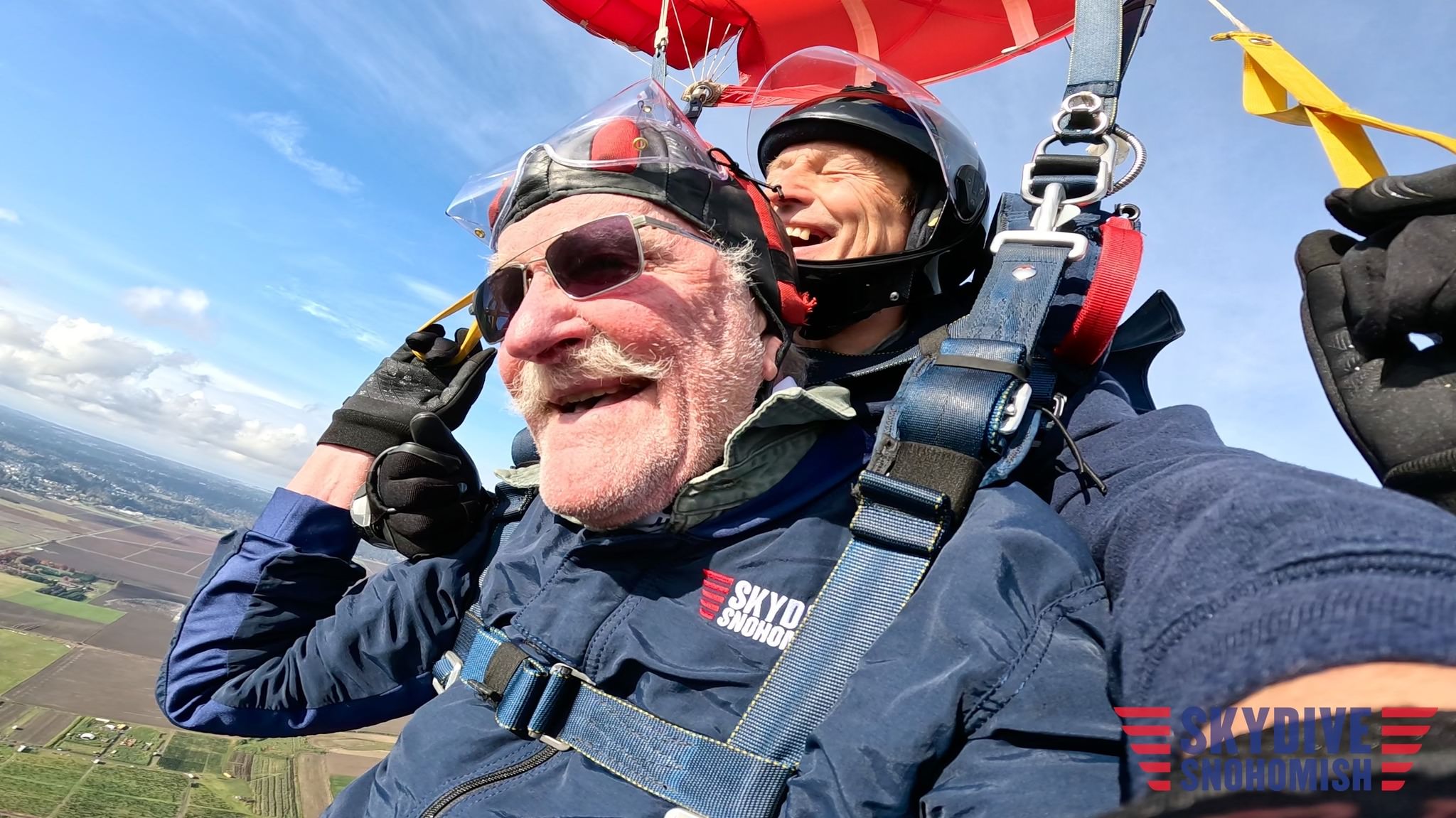 Older tandem skydiver jumping at Skydive Snohomish