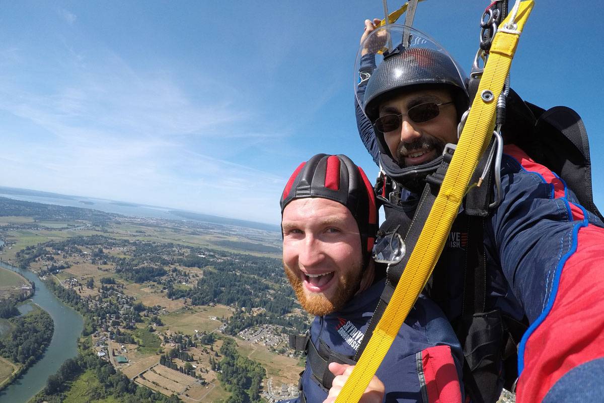 Instructor and student smiling while under canopy